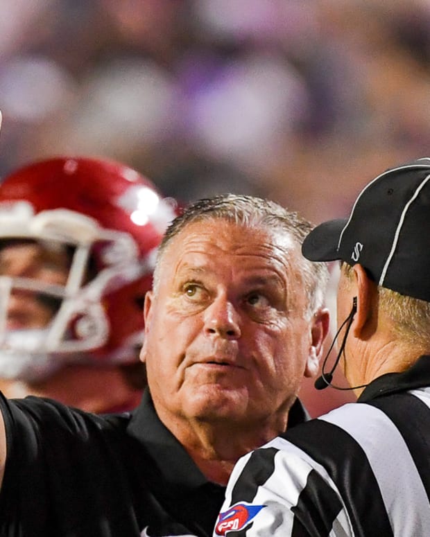 Razorbacks coach Sam Pittman pointing at replay board against LSU